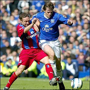 Palace midfielder Michael Hughes tries to knock Kevin Kilbane off the ball