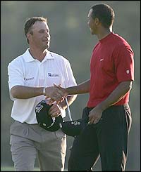 DiMarco and Woods shake hands before the play-off