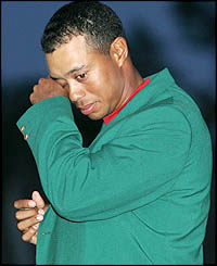 Tiger Woods wipes away a tear after his emotional victory