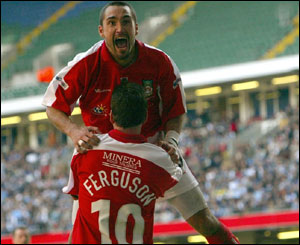 Darren Ferguson and Juan Ugarte celebrate Wrexham's second goal