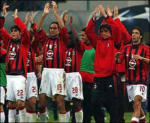 Milan's players applaud their fans for remaining calm during the trouble at the San Siro