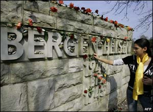 Israeli Adi Havazelet from Israel lays flowers at Belsen