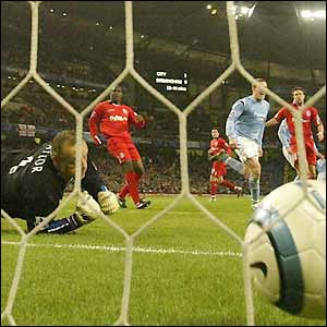 Maik Taylor can only watch as the ball finds the back of the net 