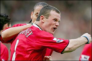 Rooney is congratulated by Rio Ferdinand 