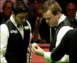 Stevens and Murphy inspect the white ball