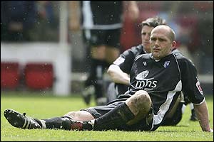 Gillingham captain Paul Smith is dejected 