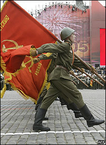 Soldiers in Soviet period uniforms march towards Red Square