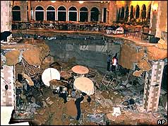 Looking down from dance floor into hole where rescuers searching