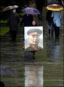 Woman in Kiev with wartime portrait of Stalin