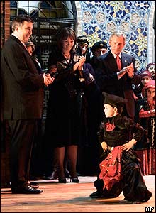 Georgian President Mikhail Saakashvili, left, and US President George Bush, right, watch traditional Georgian dancing