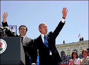 US President George W Bush (right) and Georgian President Mikhail Saakashvili wave to the crowd in Freedom Square, 10 May 2005