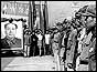 Red Guards line up in front of a portrait of Chairman Mao in Peking