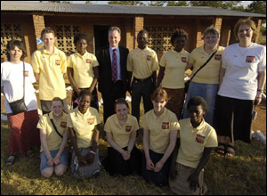 First Minister Jack McConnell alongside teachers and pupils from Mingi secondary school
