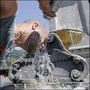Pavle from Belgrade, Serbia, refreshes himself in a fountain in Rome on 27 May