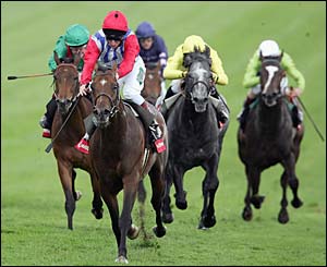  Enforcer, ridden by Martin Dwyer (second from left), wins the Vodafone Live Stakes