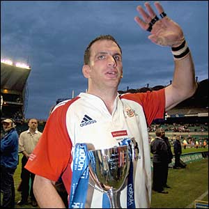 Martin Johnson waves to the crowd at his testimonial