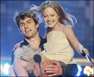 Tom Cruise carries Dakota Fanning onto the stage at the MTV movie awards in Los Angeles on Saturday