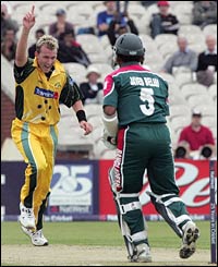 Brett Lee takes the wicket of Javed Omer Belim