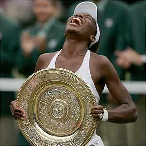 Venus Williams collects the trophy