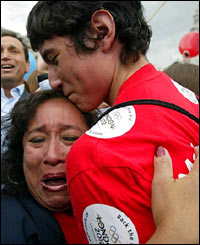 A couple in Trafalgar Square shed tears of joy