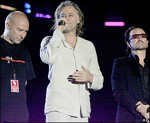 Midge Ure, concert organiser Bob Geldof and Bono at the event