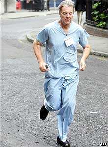 A medic runs towards the scene of the bomb blast to treat survivors