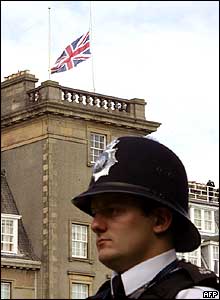 A police officer stands outside Gleneagles Hotel, where the Union flag is flying at half-mast as a mark of respect for those killed and injured in the London bombings