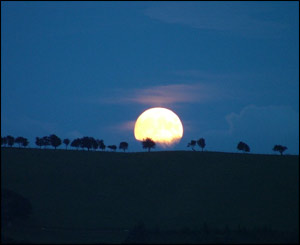 A full moon rising over the hills of Trefeglwys in Powys, taken by Suzane Ball
