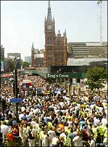 Thousands gather at King's Cross station for a two-minute silence in memory of the London bomb victims