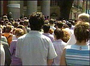 People observe the two-minute silence in Tavistock Square, scene of the bus bomb