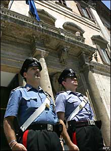 Carabinieri mark the two-minute silence outside the Italian parliament in Rome