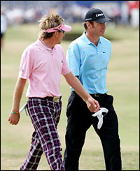 Ian Poulter (L) chats to Nick Faldo