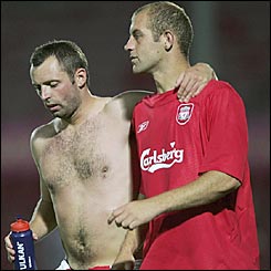 TNS defenders Tommy Holmes (L) and Steve Evans at the end of the UEFA Champions League match