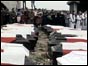 Coffins draped with flags at funeral service