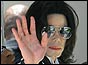 Michael Jackson waves to supporters