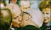 Soviet leader Mikhail Gorbachev greets East German leader Erich Honecker