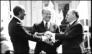Egyptian President Anwar Sadat, US President Jimmy Carter and Israeli Prime Minister Menachem Begin on the lawn of the White House after signing the peace treaty between Egypt and Israel on March 26, 1979