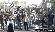 Thousands of Arabs emerge from the Nusseirat refugee camp during the Palestinian uprising in 1987