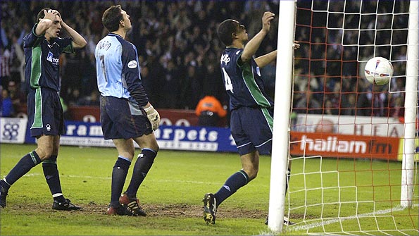 Des Walker (right) heads into his own net and Forest's Premier League dream ends in 2003 Photo: Getty