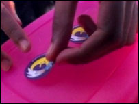 Person attaching sticker to lunchbox