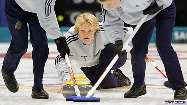 Rhona Martin watches on as Janice Rankin (left) and Fiona MacDonald sweep during Great Britain's curling gold medal success at the 2002 Olympics