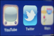 Mobile phone screen showing icons for Twitter and other apps and websites