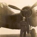 Peter Bull. Standing by Mitchell Bomber in Achman, Germany 1945