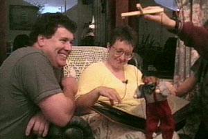 Conrad and Karen look at their wedding album