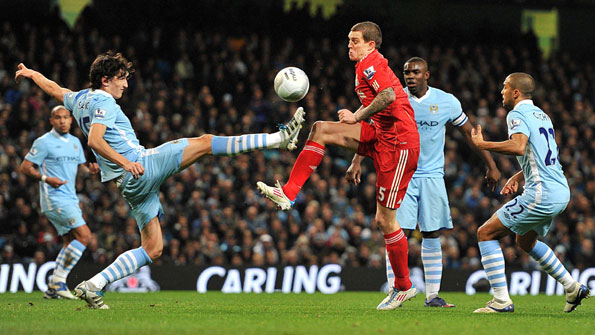 Stefan Savic fouls Daniel Agger
