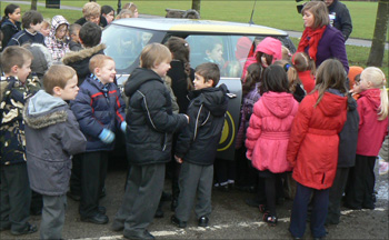 Pupils from Preston School, Stockton-on-Tees looking at the car