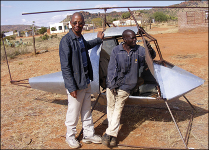 South Africa: Two men from Ga-Masemola village, near Polokwane, stand by the framework of their self-made helicopter – now they just have to fit an engine to make their first voyage. 