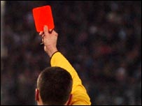 Referee with red card (Empics)
