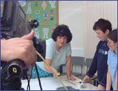 Image of pupils being taught how to paint
