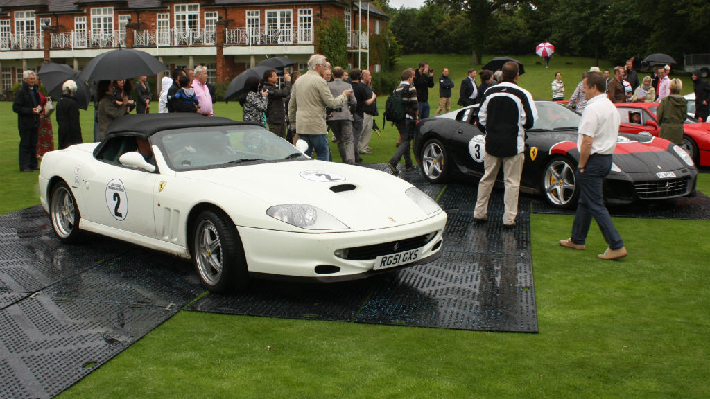 A bit of rain isn't going to deter these petrol-heads from turning up to have a look.